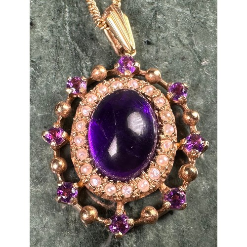 991 - A Victorian style 9ct gold oval amethyst and seen pearl pendant, the large central amethyst cabochon... 