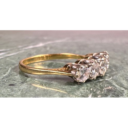 950 - A diamond ring, set with five graduated round brilliant cut diamonds, total estimated diamond weight... 