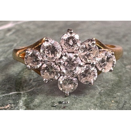 949 - A diamond ring, lozenge crest set with nine round brilliant cut diamonds, total estimated diamond we... 