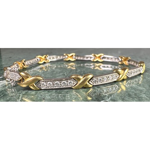 945 - A diamond fancy X and bar link bracelet, composed of ten yellow gold X links and ten diamond accente... 