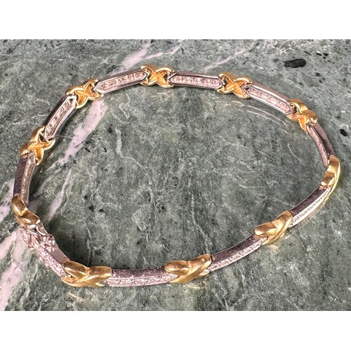 945 - A diamond fancy X and bar link bracelet, composed of ten yellow gold X links and ten diamond accente... 