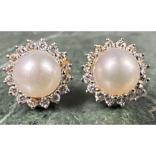 972 - A pair of diamond and cultured pearl cluster earrings, central white cultured pearl surrounded by si... 