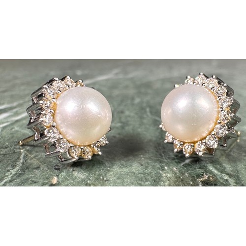 972 - A pair of diamond and cultured pearl cluster earrings, central white cultured pearl surrounded by si... 