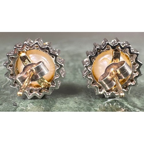 972 - A pair of diamond and cultured pearl cluster earrings, central white cultured pearl surrounded by si... 