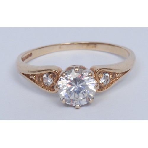 956 - A diamond solitaire ring, the brilliant cut stone approx 0.5ct, claw set, the shoulders with further... 