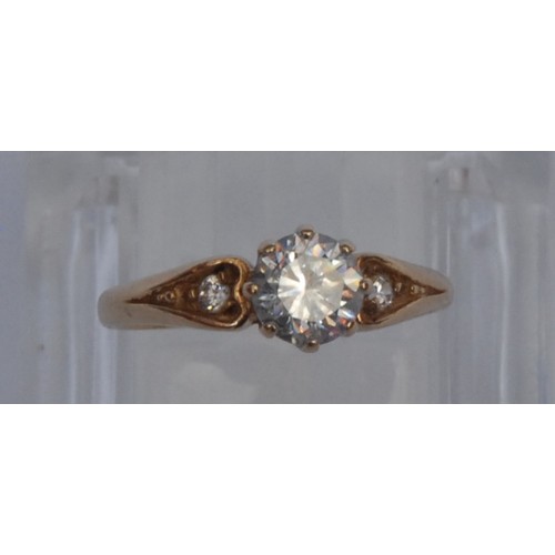 956 - A diamond solitaire ring, the brilliant cut stone approx 0.5ct, claw set, the shoulders with further... 