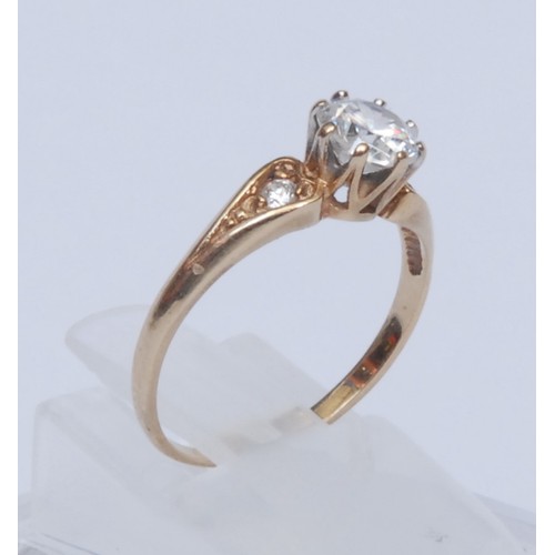 956 - A diamond solitaire ring, the brilliant cut stone approx 0.5ct, claw set, the shoulders with further... 