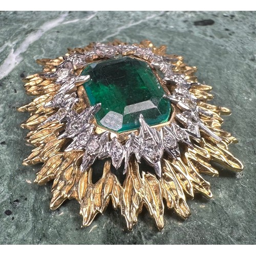 1026 - An emerald, diamond and gold coloured metal sunburst brooch, the central doublet within an irregular... 