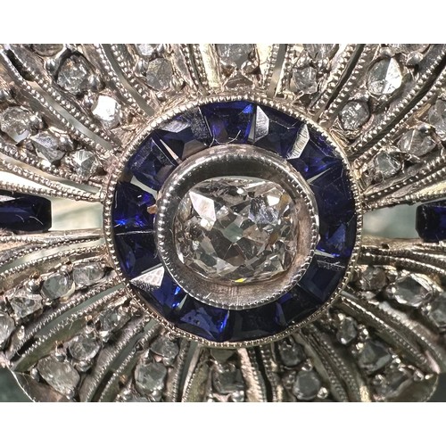 1016 - An Art Deco diamond and sapphire panel bracelet in the manner of Cartier, each panel centered with a... 