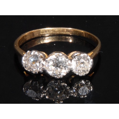 951 - A diamond ring, set with three old European cut diamonds,  ranging between approx 4.6mm and 5.1mm di... 