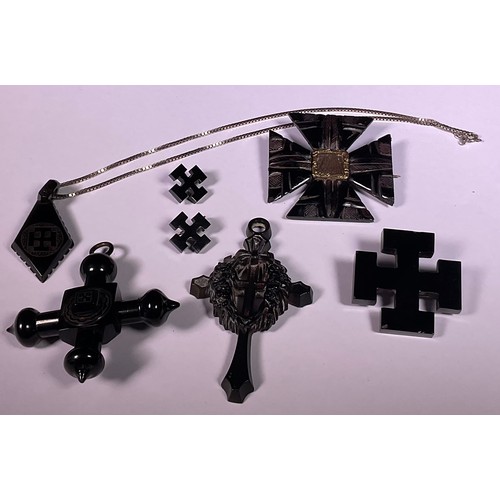 998 - A Victorian Whitby Jet mourning brooch, set with a waxed lock of hair; an associated four piece suit... 