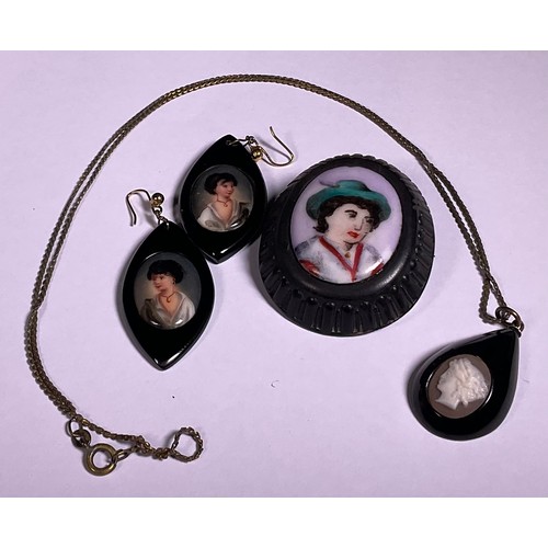 994 - A Victorian Whitby Jet cameo pendant; brooch and pair of droplet earrings (4)