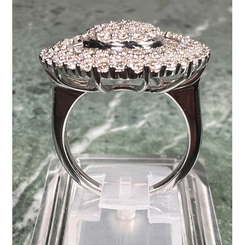 966 - A large diamond teardrop cluster ring, pave set with baguette and round brilliant cut diamonds, tota... 