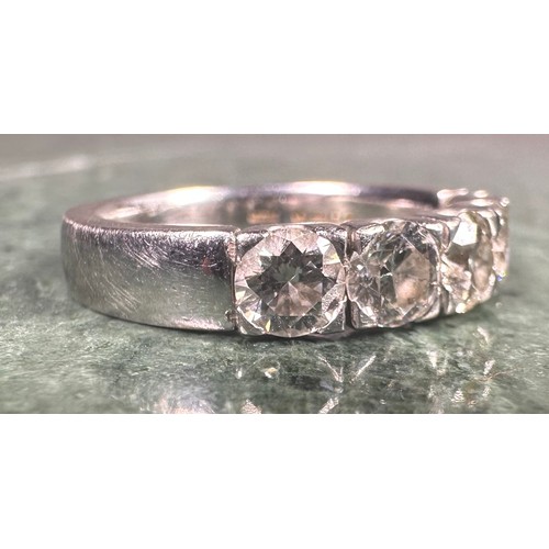 948 - A diamond ring, linear set with five round brilliant cut diamonds, total estimated diamond weight ap... 