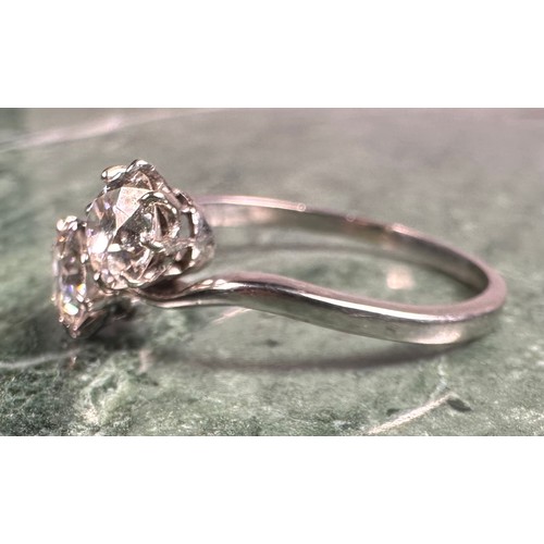 944 - A diamond cross-over twist ring, set with two round brilliant cut diamonds, each approx 0.52ct, tota... 