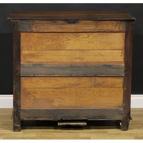 2084 - An early 18th century oak chest, oversailing rectangular top above three drawers, applied with geome... 