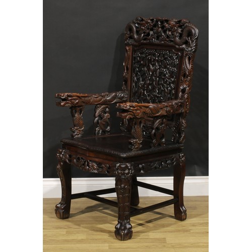 1628 - A Chinese hardwood armchair, pierced and profusely carved with dragons, Guanyin and attendants, 111c... 