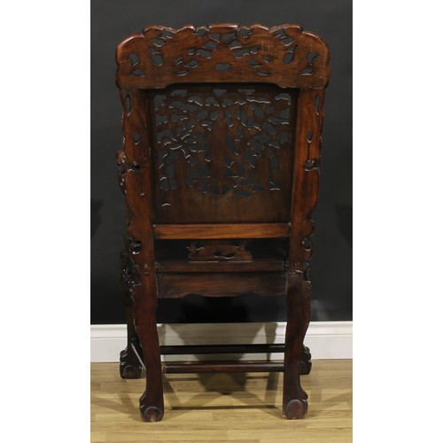 1628 - A Chinese hardwood armchair, pierced and profusely carved with dragons, Guanyin and attendants, 111c... 