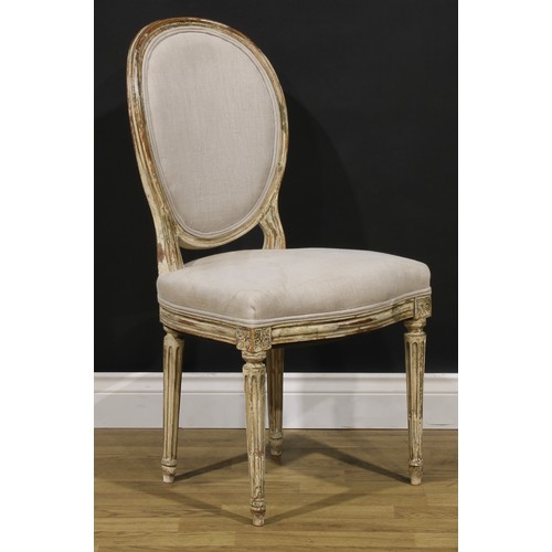 1596 - A pair of French Neoclassical painted softwood side chairs, stuffed-over upholstery, stop-fluted leg... 