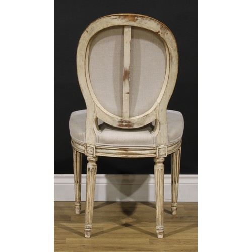 1596 - A pair of French Neoclassical painted softwood side chairs, stuffed-over upholstery, stop-fluted leg... 