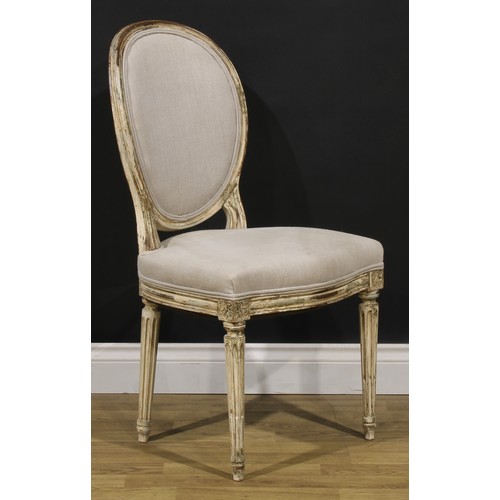 1596 - A pair of French Neoclassical painted softwood side chairs, stuffed-over upholstery, stop-fluted leg... 