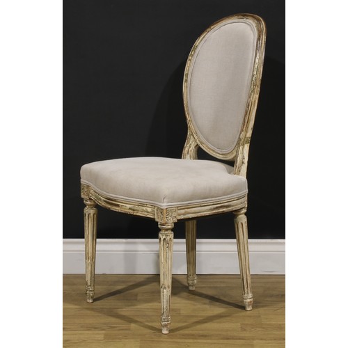 1596 - A pair of French Neoclassical painted softwood side chairs, stuffed-over upholstery, stop-fluted leg... 