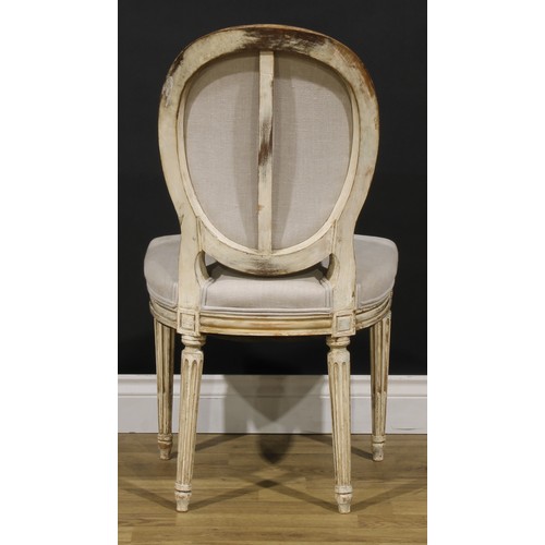 1596 - A pair of French Neoclassical painted softwood side chairs, stuffed-over upholstery, stop-fluted leg... 