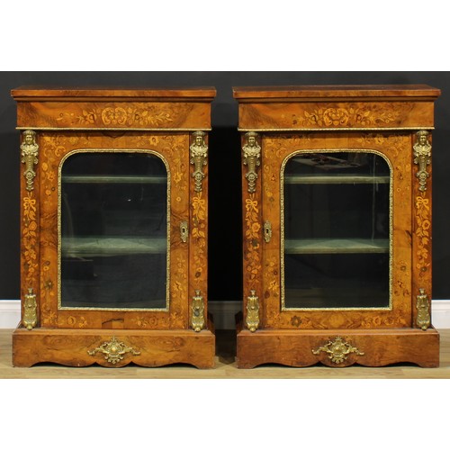 1608 - A pair of Victorian gilt metal mounted walnut and marquetry pier cabinets, each with oversailing rec... 