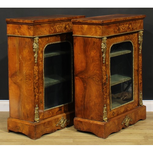 1608 - A pair of Victorian gilt metal mounted walnut and marquetry pier cabinets, each with oversailing rec... 