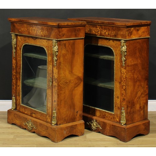 1608 - A pair of Victorian gilt metal mounted walnut and marquetry pier cabinets, each with oversailing rec... 