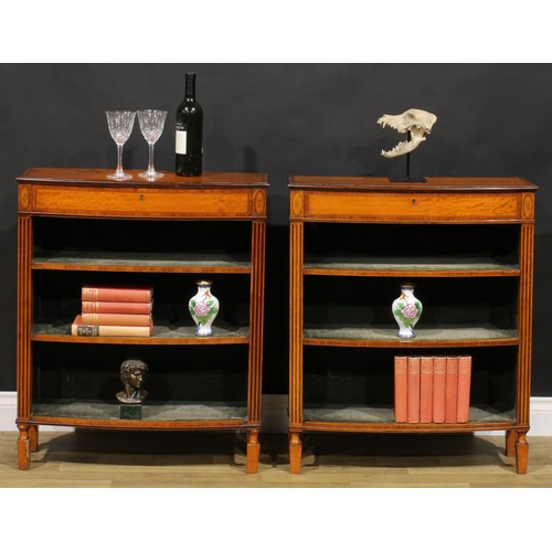 1604 - A pair of Sheraton Revival tulipwood banded satinwood library pier bookcases, each with a slightly o... 