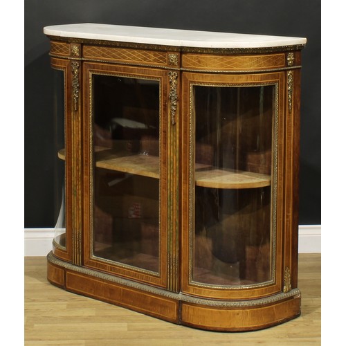 2090 - A Victorian gilt metal mounted walnut and fiddleback mahogany credenza, marble top above a glazed do... 