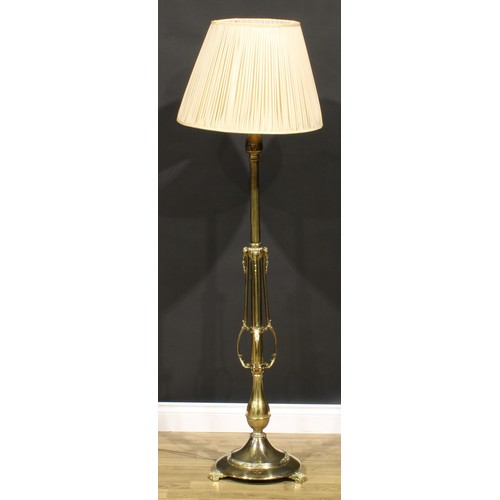 2047 - Interior Design - a Neoclassical Revival brass telescopic floor lamp, cast with ram heads, 136cm hig... 