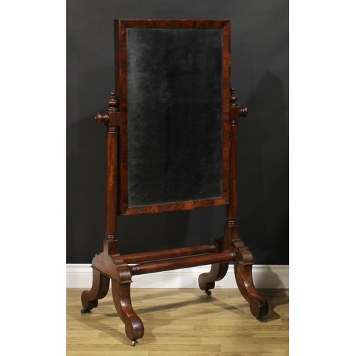 1621 - A 19th century mahogany cheval mirror, turned supports, brass casters, 135cm high, 77cm wide, 56cm d... 