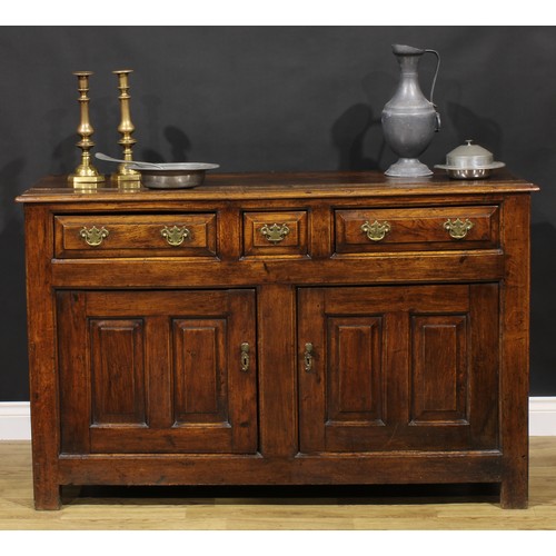 2122 - An 18th century oak low dresser, slightly oversailing top above three frieze drawers and a pair of r... 