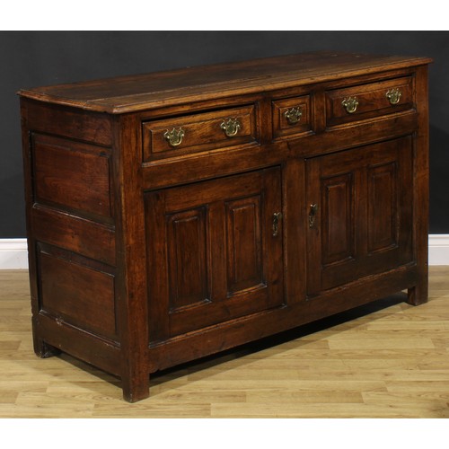 2122 - An 18th century oak low dresser, slightly oversailing top above three frieze drawers and a pair of r... 