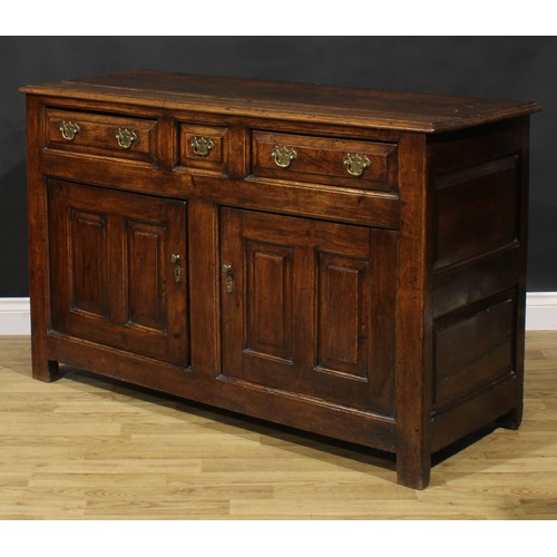 2122 - An 18th century oak low dresser, slightly oversailing top above three frieze drawers and a pair of r... 