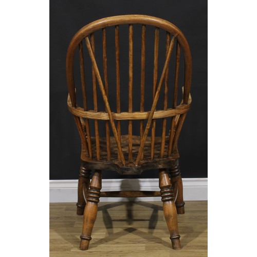 1581 - A beech, ash and elm Windsor elbow chair, hoop back, turned arm posts, saddle seat, turned legs, H-s... 