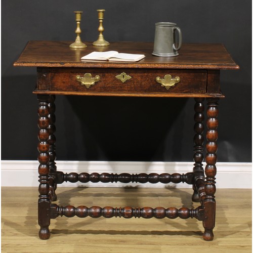 1626 - A Charles II oak side table, rectangular top above a long frieze drawer, bobbin turned legs and stre... 