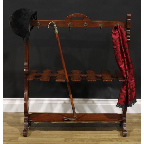 2150 - A Victorian walnut country house riding crop and boot rack, shaped and pierced end supports, scroll ... 