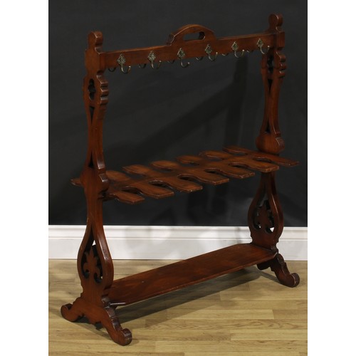 2150 - A Victorian walnut country house riding crop and boot rack, shaped and pierced end supports, scroll ... 