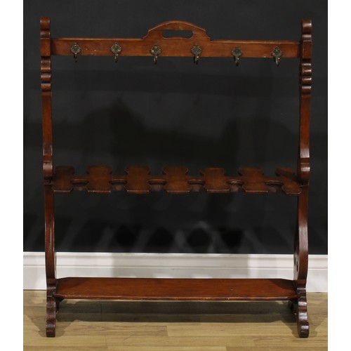 2150 - A Victorian walnut country house riding crop and boot rack, shaped and pierced end supports, scroll ... 