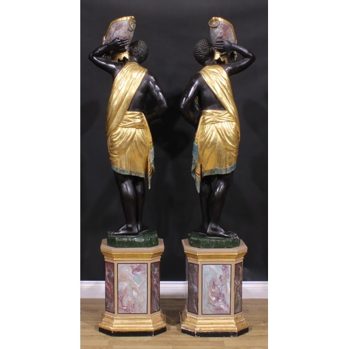 1607 - A pair of Venetian parcel-gilt and polychrome painted blackamoor torcheres, each carved as a Nubian ... 