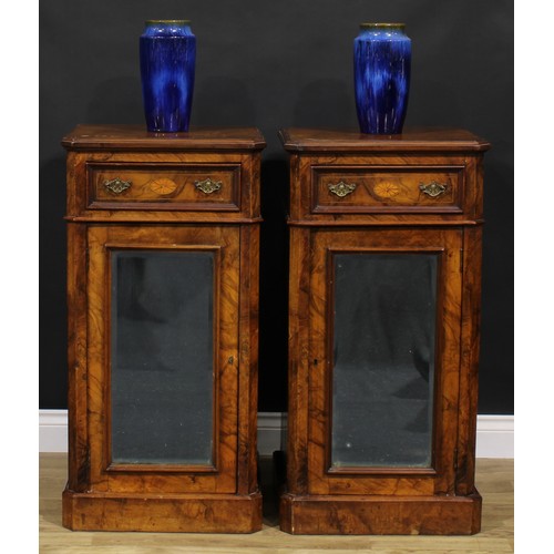 1609 - A pair of Victorian walnut and marquetry pedestal cabinets, each canted rectangular top above a frie... 