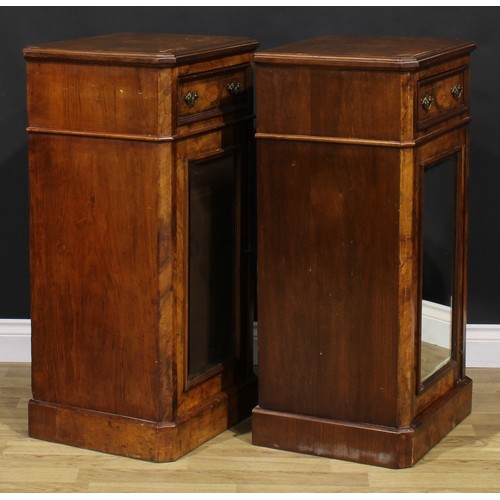 1609 - A pair of Victorian walnut and marquetry pedestal cabinets, each canted rectangular top above a frie... 