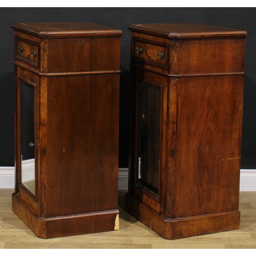 1609 - A pair of Victorian walnut and marquetry pedestal cabinets, each canted rectangular top above a frie... 