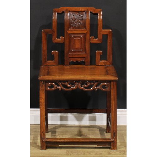 1630 - A Chinese hardwood chair, the back carved with scrolls and blossoming prunus, shaped and pierced apr... 