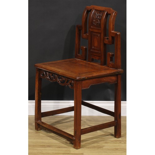 1630 - A Chinese hardwood chair, the back carved with scrolls and blossoming prunus, shaped and pierced apr... 