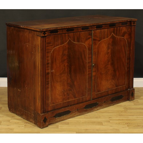 2109 - An early 19th century mahogany low press cupboard, rectangular doors inlaid with lancet arched reser... 