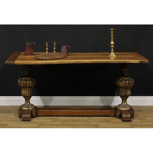 1588 - A French Provincial parcel-gilt walnut refectory table, of domestic proportions, 71cm high, 152cm lo... 